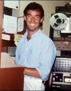 Ray typing the next news update at Newsradio WFLA (Tampa) in 1988.